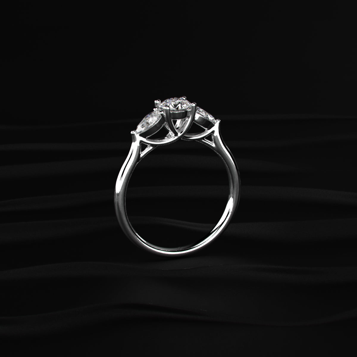 Round Diamond Ring With Pear Side Stones
