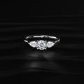 Round Diamond Ring With Pear Side Stones