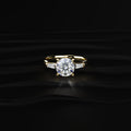 Round Solitaire Engagement Ring With Tapered Baguette