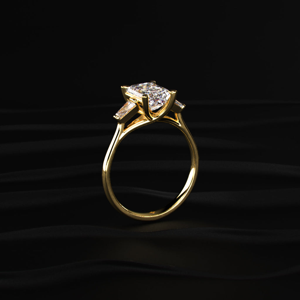 Emerald Solitaire Engagement Ring With Tapered Baguette