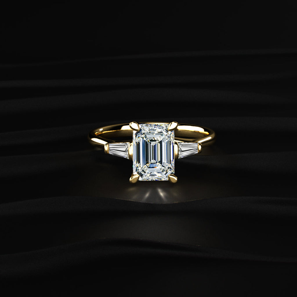 Emerald Solitaire Engagement Ring With Tapered Baguette