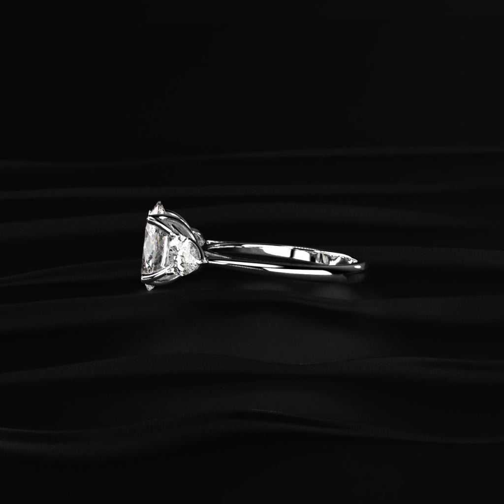 Oval Diamond Triology Ring In Floral Setting With Side Pear