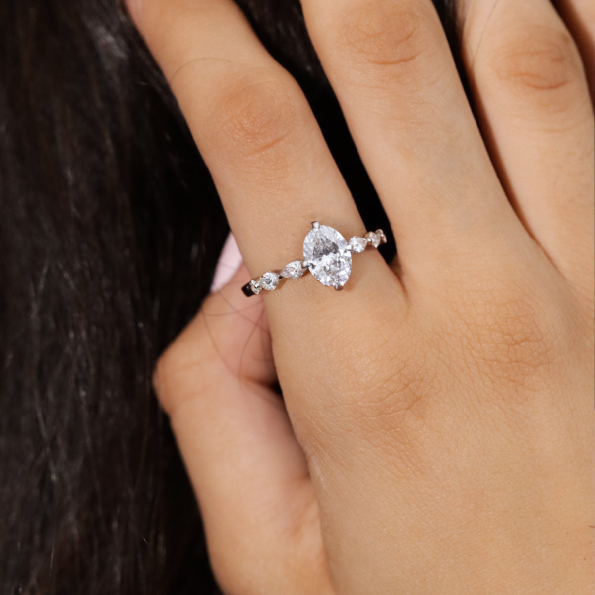 Oval Diamond Ring With Marquise Side Stones